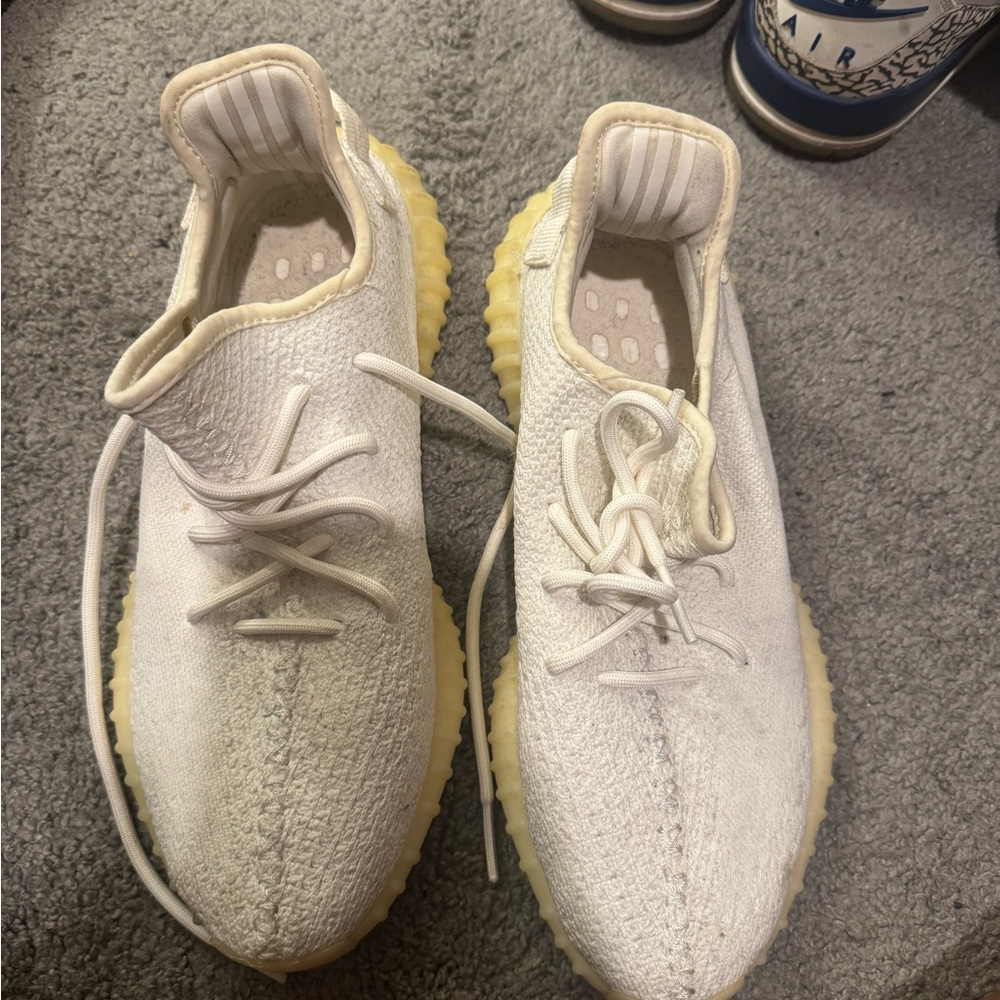 Yeezy Cream and Yellow Athletic Shoes